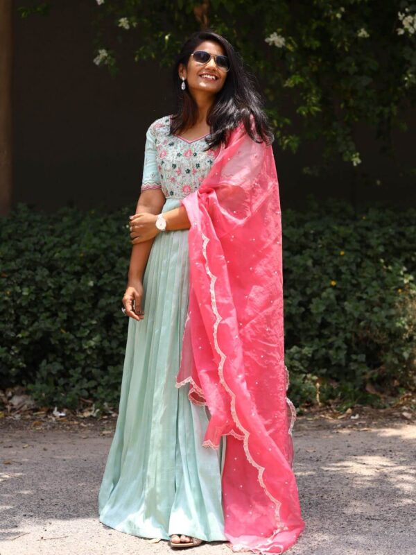 Mint green long dress with a hand emdroidered body and a contrast pink dupatta