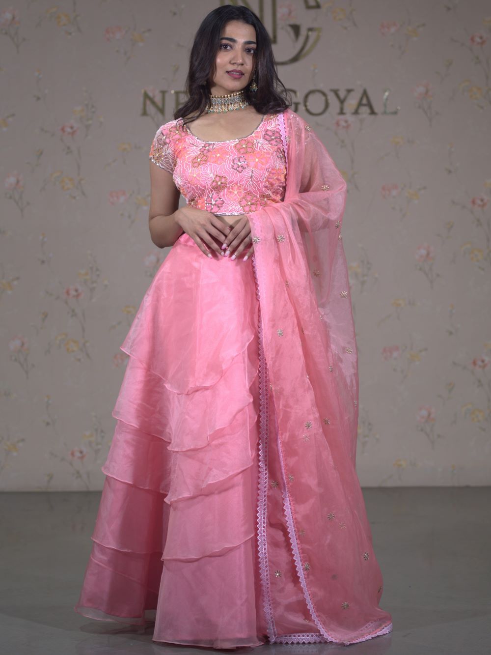 Pearl pink 4 layered lehenga paired with embroidered blouse