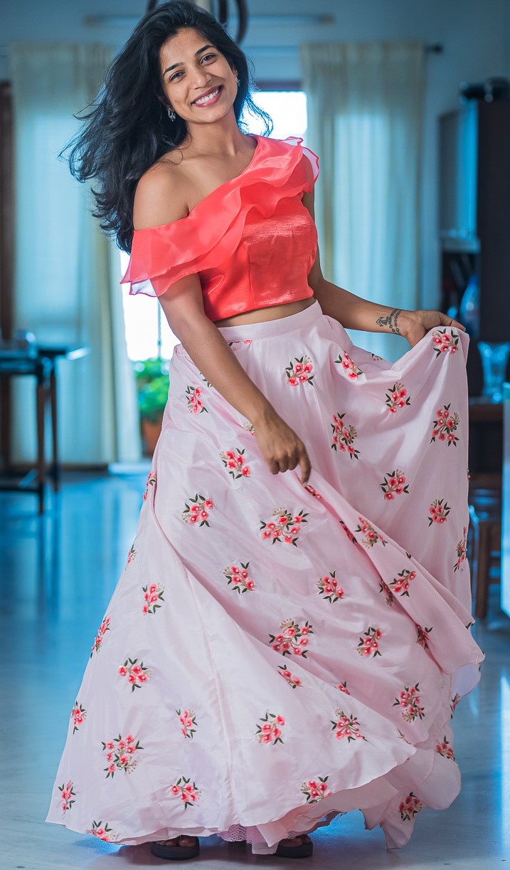 Floral baby pink Lehenga paired with a one shoulder crop top