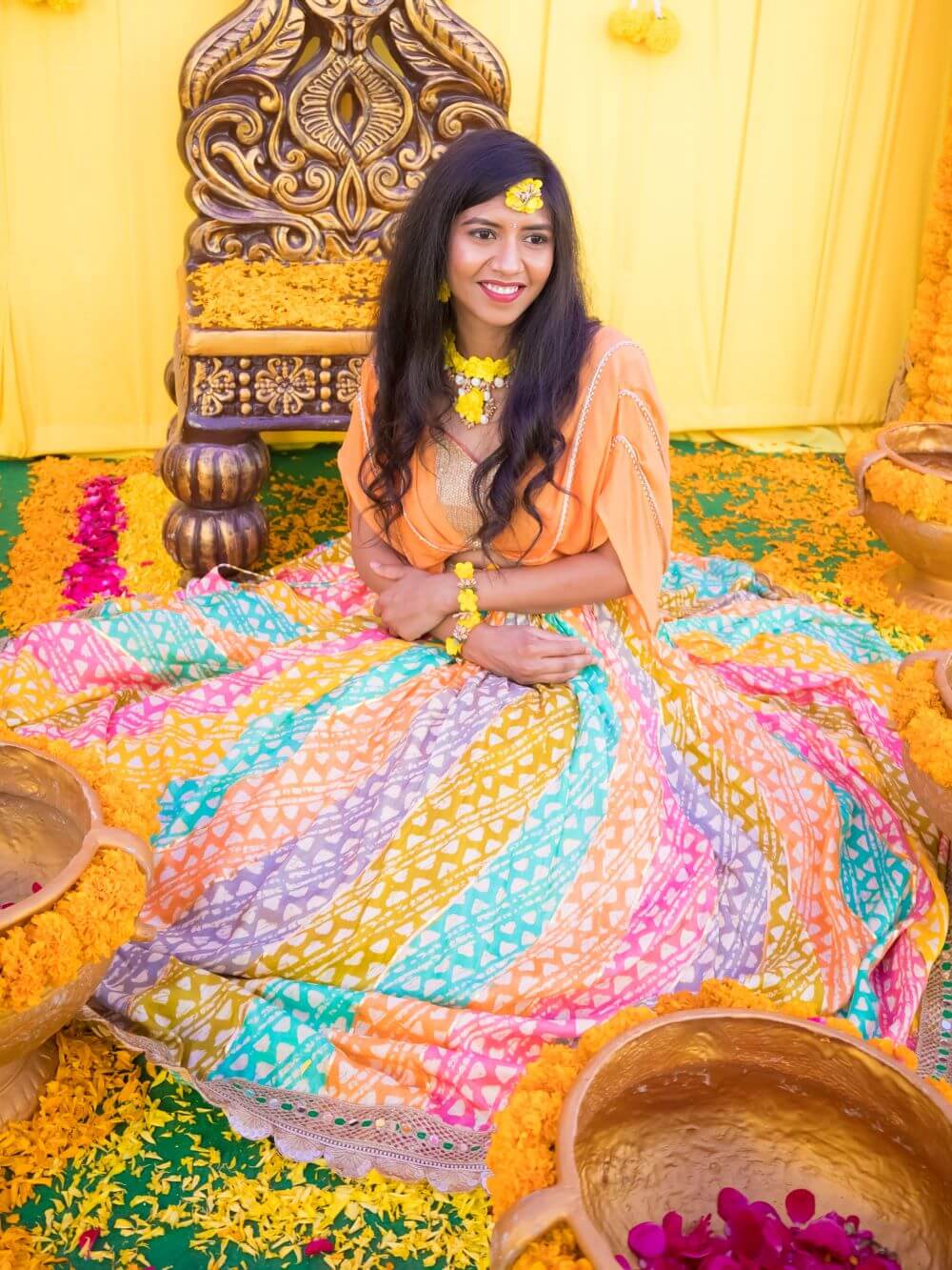 Haldi Multicolor lehenga Paired with a classic layered crop top