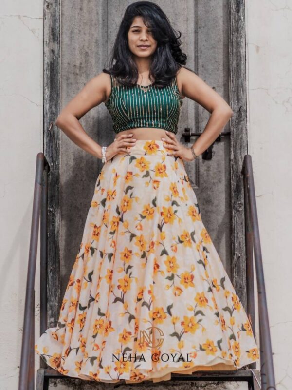 Yellow floral skirt paired with a bottle green sleeveless crop top